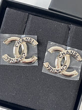 Load image into Gallery viewer, Chanel 25C Gold Tone CC Black Script Earrings
