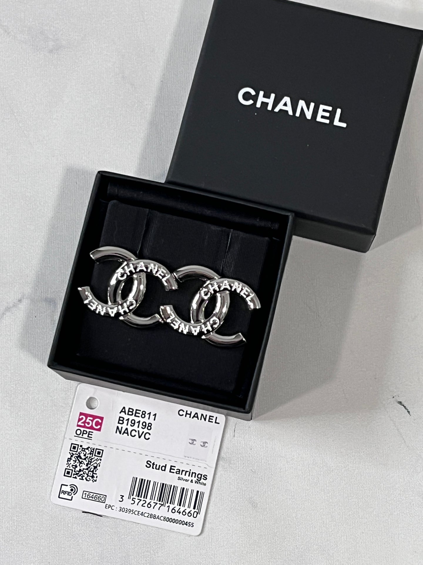 Chanel 25C Silver Tone CC White Script Earrings