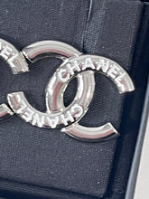 Load image into Gallery viewer, Chanel 25C Silver Tone CC White Script Earrings
