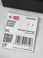 Load image into Gallery viewer, Chanel 23A Gold Tone CC Pendant Earrings
