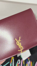 Load and play video in Gallery viewer, Saint Laurent YSL Cassandre Bordeaux Passport Holder
