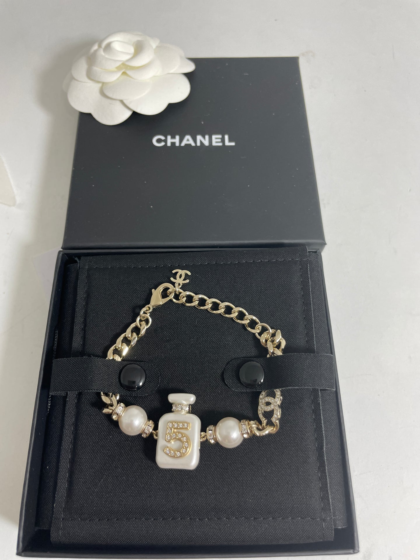 Chanel 22S CC Gold Tone Pearly White Perfume Bottle Bracelet