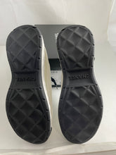 Load image into Gallery viewer, Chanel Ivory With Black Accent Calfskin Trainer Sneakers
