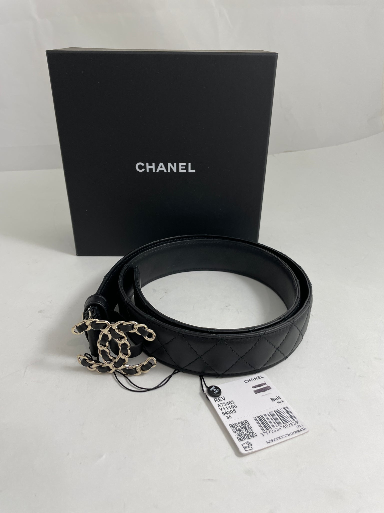 Chanel black quilted caviar leather belt with silver CC logo chain buckle.